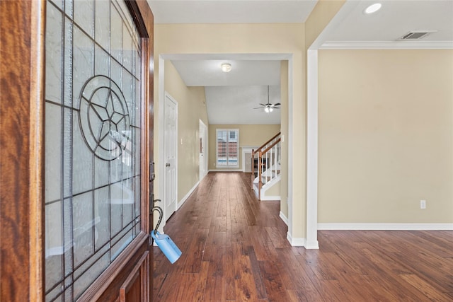 entrance foyer with baseboards, visible vents, dark wood-style floors, ceiling fan, and stairway