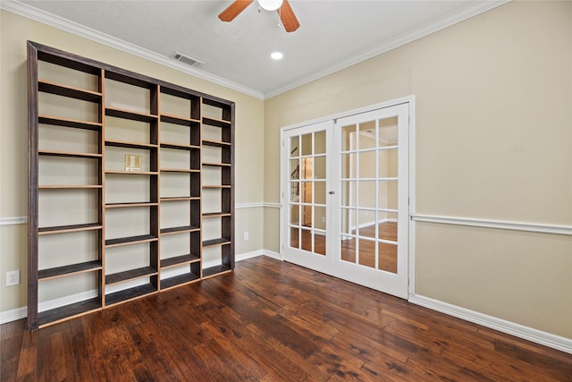 unfurnished room with baseboards, visible vents, dark wood finished floors, ornamental molding, and french doors