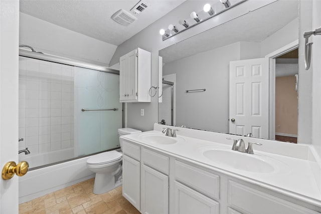 full bathroom featuring toilet, a sink, and visible vents