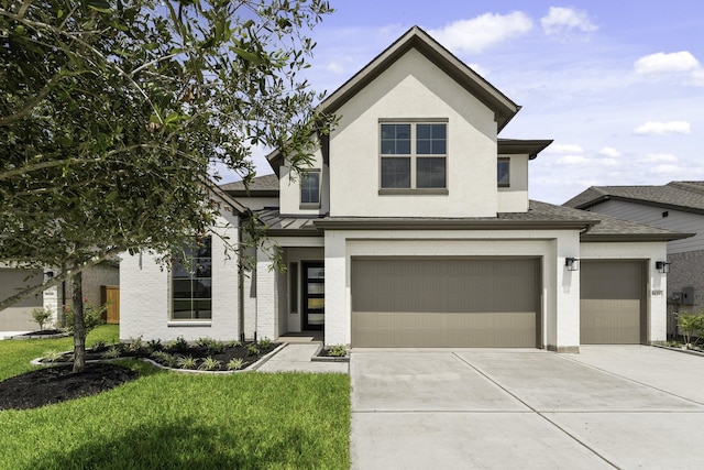 view of front of property with a front lawn, stucco siding, metal roof, driveway, and a standing seam roof