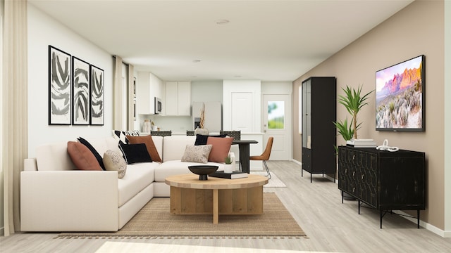 living area featuring light wood finished floors and baseboards