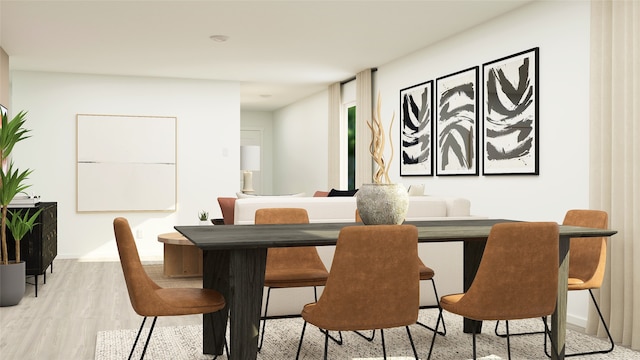 dining space featuring light wood-style floors