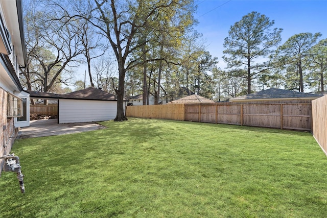 view of yard with a patio area and a fenced backyard