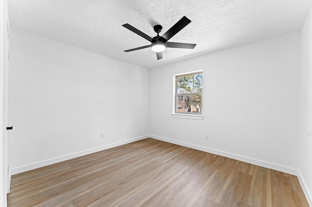 unfurnished room with light wood-style flooring, baseboards, and ceiling fan