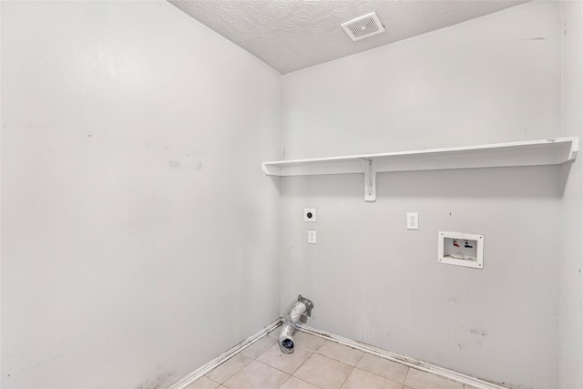 washroom featuring light tile patterned floors, hookup for a washing machine, hookup for an electric dryer, laundry area, and visible vents