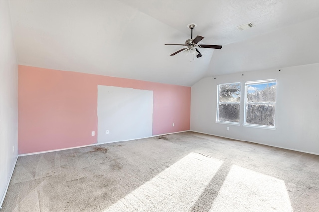 bonus room featuring lofted ceiling, carpet, ceiling fan, and visible vents