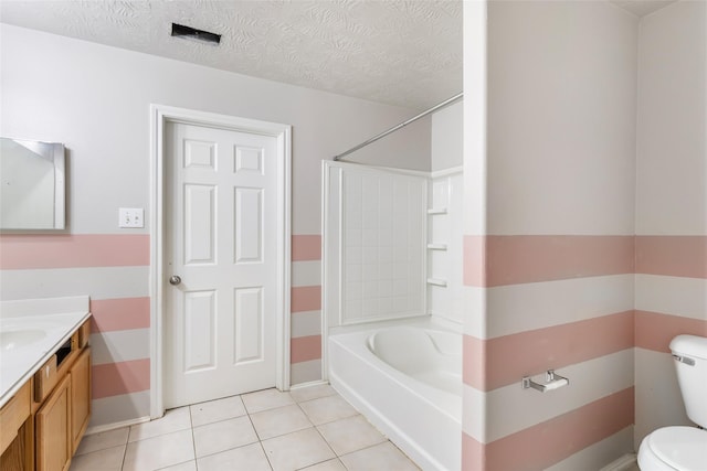 full bathroom featuring a textured ceiling, tile patterned flooring, toilet, vanity, and tub / shower combination