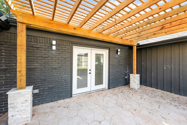 view of patio / terrace with french doors and a pergola