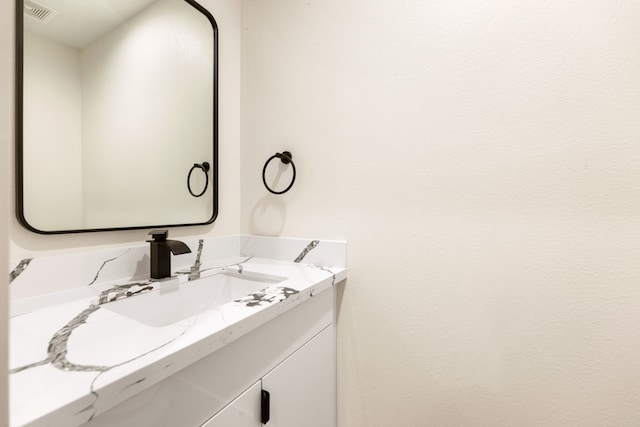 bathroom with visible vents and vanity