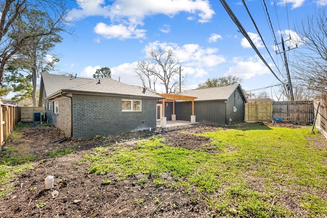 back of property featuring brick siding, central air condition unit, a gate, a patio area, and a fenced backyard