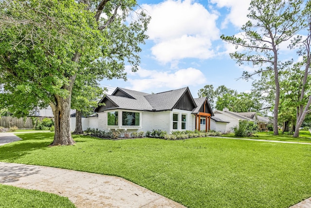 8018 Highmeadow Dr, Houston, TX 77063 - view of front of property with brick siding, a shingled roof, and board and batten siding