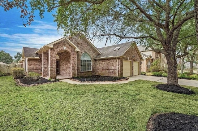 ranch-style home featuring driveway, brick siding, a front lawn, and an attached garage