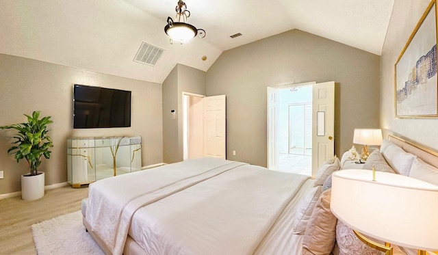 bedroom featuring visible vents, vaulted ceiling, and baseboards