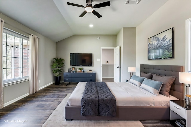 bedroom with a ceiling fan, visible vents, vaulted ceiling, baseboards, and dark wood-style floors