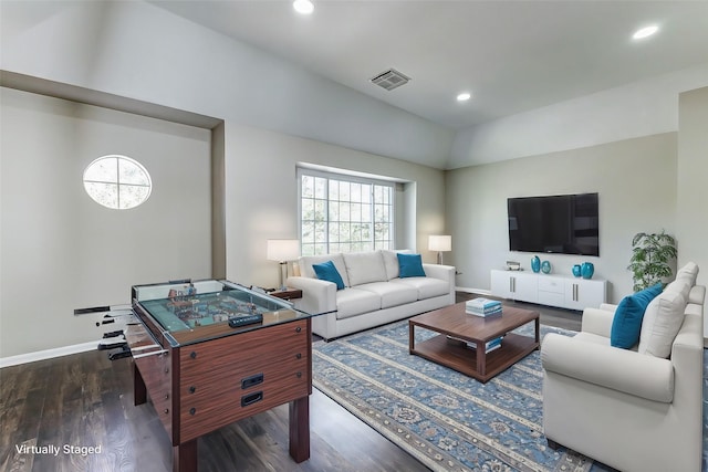 living area featuring recessed lighting, visible vents, vaulted ceiling, wood finished floors, and baseboards