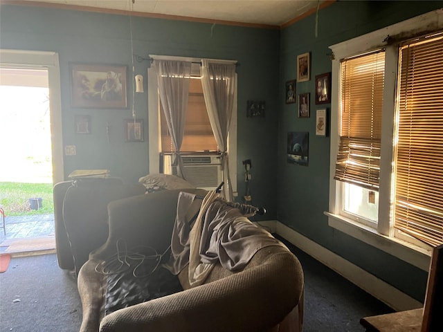 interior space featuring baseboards and cooling unit