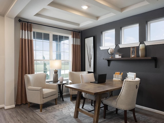 dining room with beam ceiling, coffered ceiling, baseboards, and wood finished floors