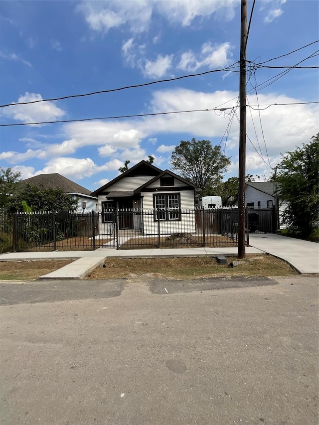 view of front facade with a fenced front yard and a gate