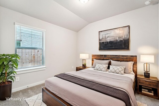 2542 Bay Winds Ln, Baytown, TX 77523 - bedroom with carpet floors, baseboards, and vaulted ceiling