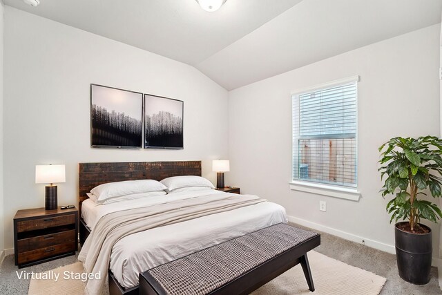 2542 Bay Winds Ln, Baytown, TX 77523 - bedroom with light colored carpet, baseboards, and lofted ceiling