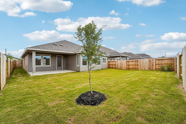 2542 Bay Winds Ln, Baytown, TX 77523 - rear view of house with a patio area and roof with shingles