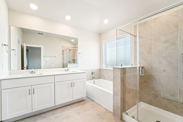 2542 Bay Winds Ln, Baytown, TX 77523 - bathroom with double vanity, a bath, a shower stall, tile patterned flooring, and recessed lighting