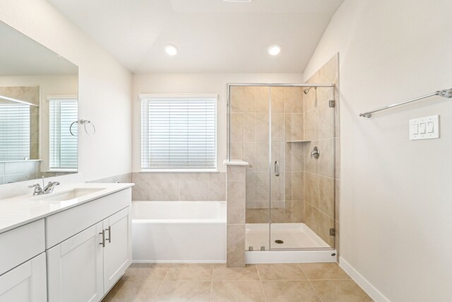 2542 Bay Winds Ln, Baytown, TX 77523 - full bath featuring vanity, a bath, tile patterned flooring, a stall shower, and recessed lighting