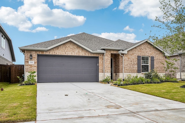 2542 Bay Winds Ln, Baytown, TX 77523 - single story home with an attached garage, brick siding, driveway, roof with shingles, and stone siding