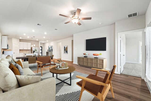 2542 Bay Winds Ln, Baytown, TX 77523 - living room with wood finished floors, baseboards, ceiling fan, and recessed lighting