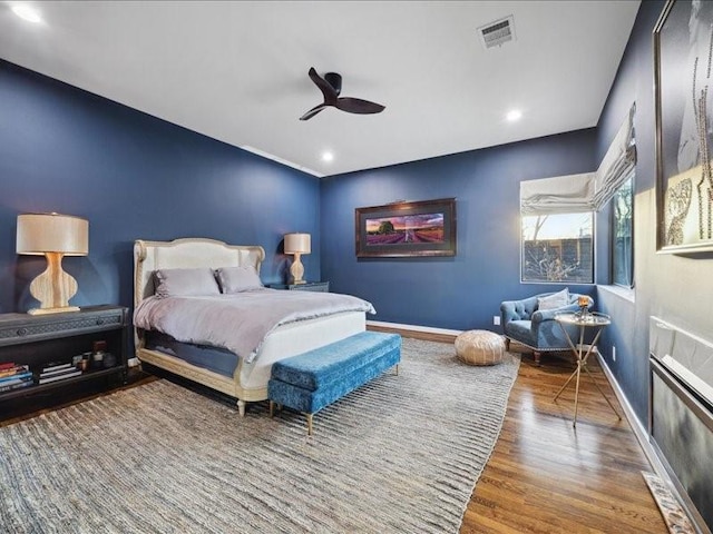 bedroom featuring recessed lighting, visible vents, ceiling fan, wood finished floors, and baseboards