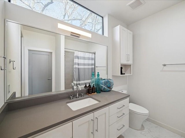 bathroom with marble finish floor, visible vents, toilet, vanity, and baseboards