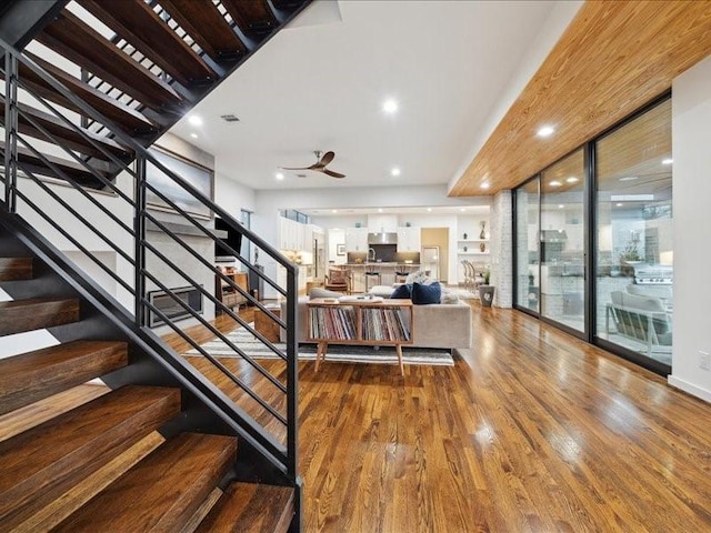 interior space featuring wood finished floors, visible vents, and recessed lighting