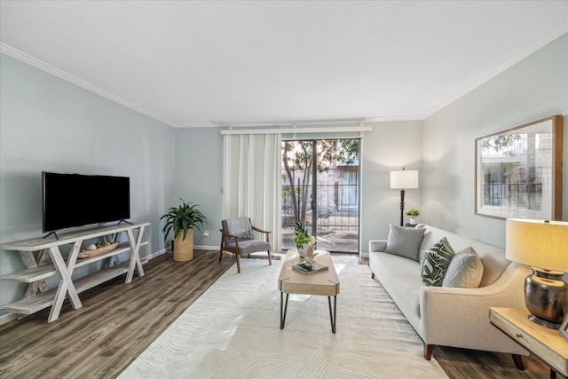 living area featuring baseboards, wood finished floors, and crown molding