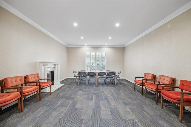 sitting room featuring a fireplace, baseboards, dark colored carpet, and crown molding