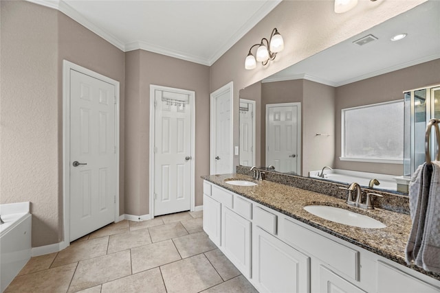 bathroom featuring crown molding, visible vents, a sink, and a garden tub