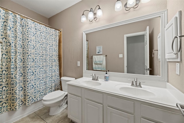 full bath featuring tile patterned flooring, a shower with shower curtain, a sink, and toilet