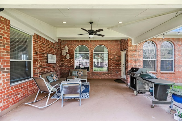 view of patio featuring a ceiling fan, grilling area, and an outdoor hangout area