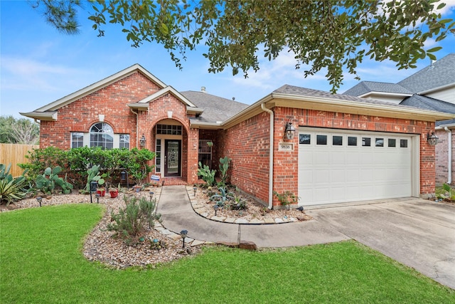 view of front facade with an attached garage, roof with shingles, concrete driveway, and brick siding