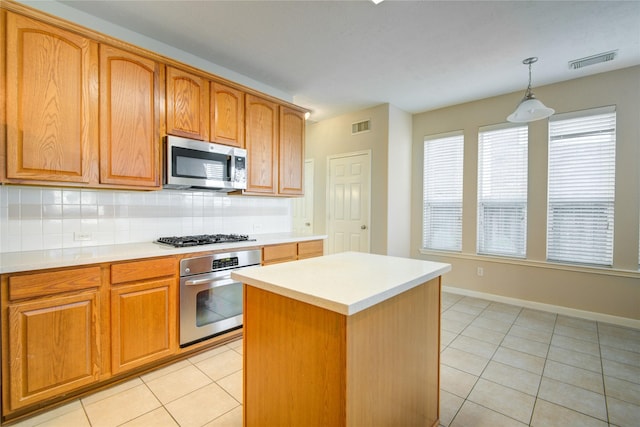 kitchen featuring light tile patterned floors, appliances with stainless steel finishes, backsplash, and visible vents