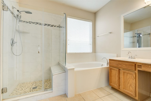 full bathroom with tile patterned flooring, a shower stall, vanity, and a bath