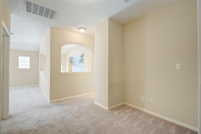 interior space with carpet, visible vents, and baseboards