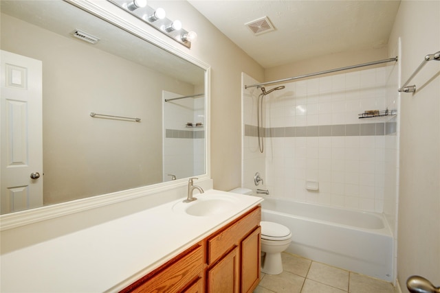 bathroom featuring tile patterned flooring, visible vents, vanity, and toilet