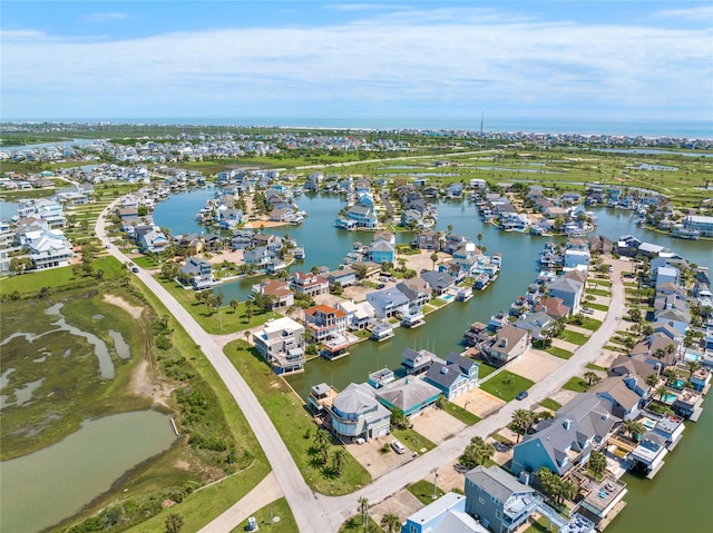 bird's eye view with a residential view and a water view