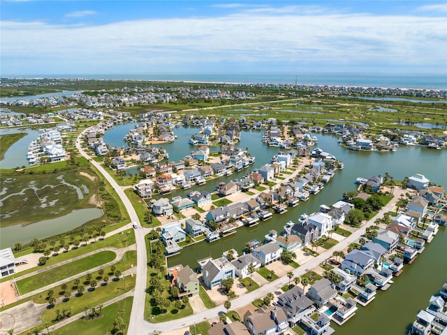 bird's eye view featuring a water view and a residential view