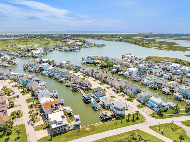 bird's eye view with a residential view and a water view