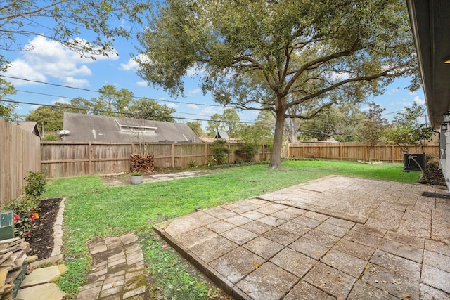 view of yard featuring a patio area and a fenced backyard