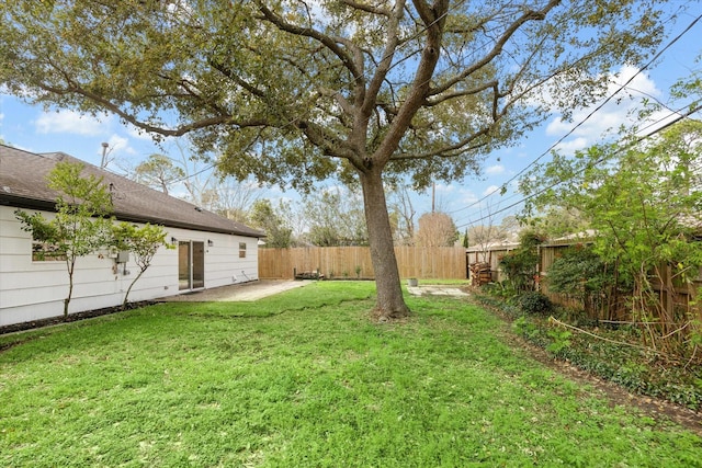 view of yard with a patio and a fenced backyard