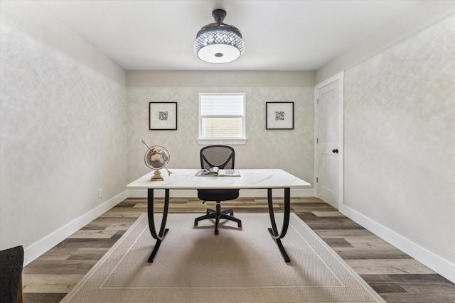 office with wood finished floors and baseboards