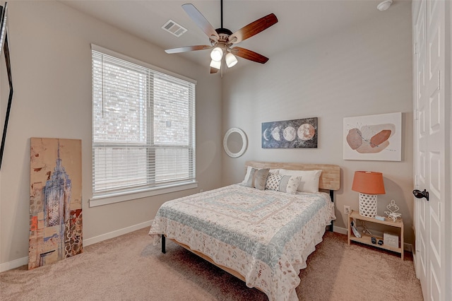 bedroom featuring carpet floors, visible vents, ceiling fan, and baseboards