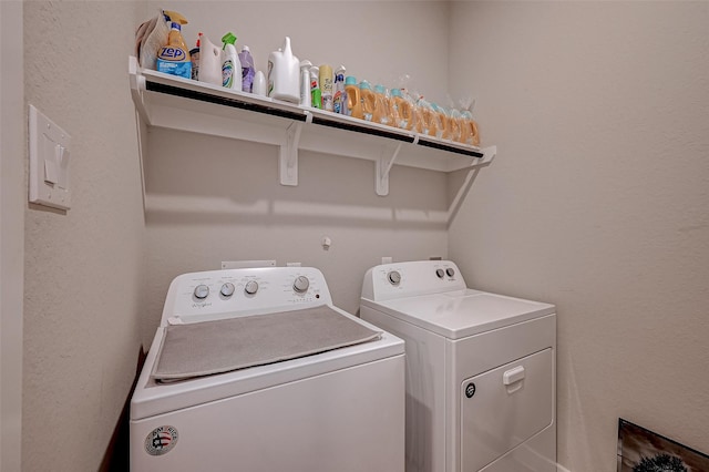 laundry room with laundry area and washing machine and clothes dryer